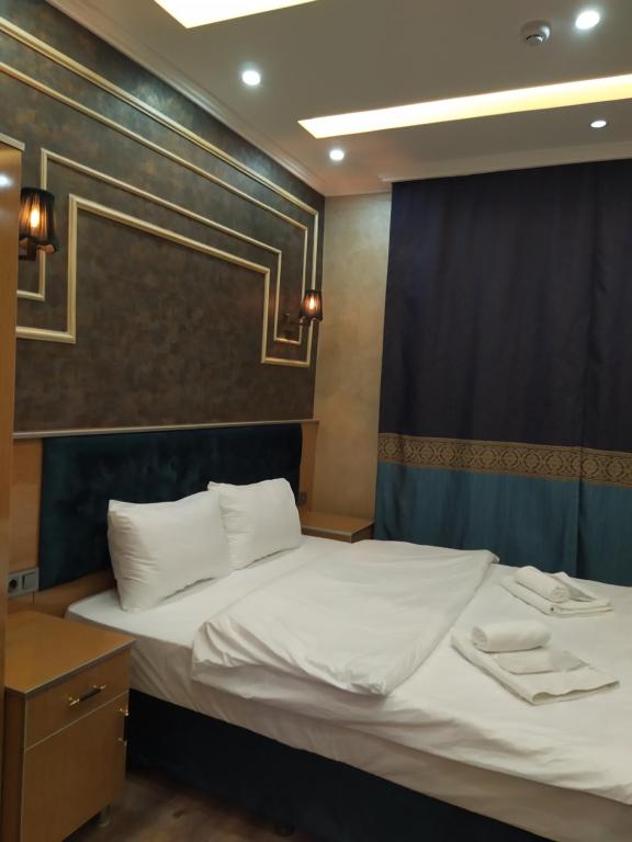 A bed or beds in a room at BoNaMi Hotel
