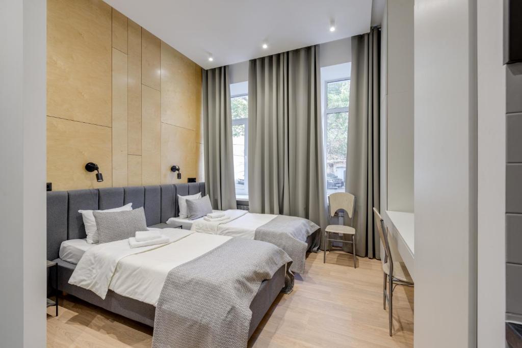 Postel nebo postele na pokoji v ubytování Centrooms Kropivnizkogo Mini-Hotel