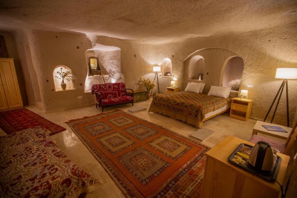 Postel nebo postele na pokoji v ubytování Maze Of Cappadocia Hotel