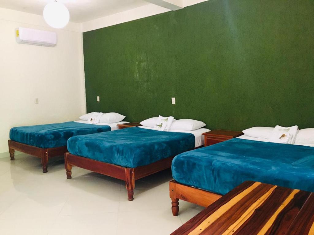Postel nebo postele na pokoji v ubytování Hotel Maya Balam