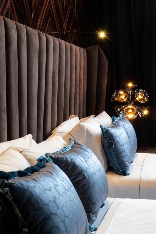 Postel nebo postele na pokoji v ubytování U-Visionary Roma Hotel