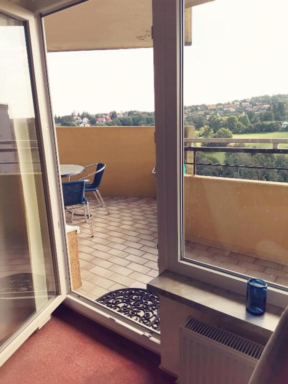 a view of a balcony with a view of a table at Ferienwohnung Harz Hohegeiß App 569 in Braunlage