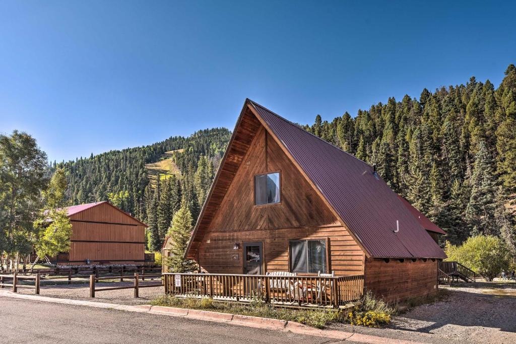 a large wooden house with a gambrel roof at Ski-In and Ski-Out Red River Cabin with Mtn Views! in Red River