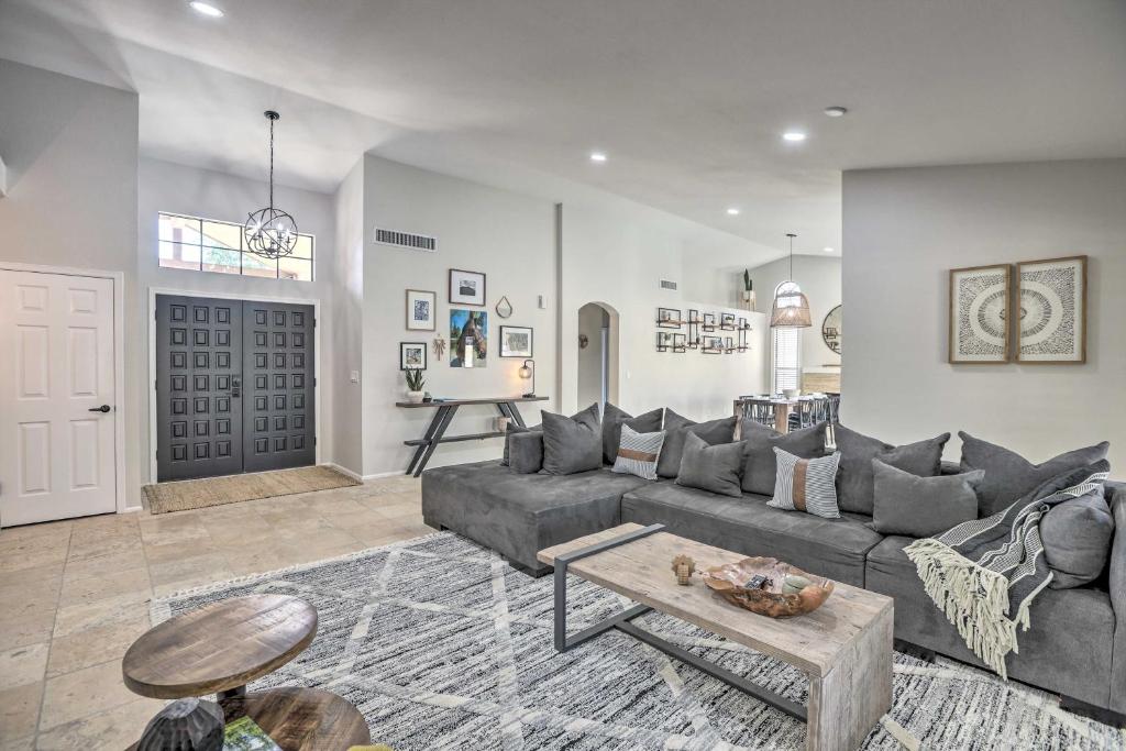 a living room with a couch and a table at Upscale Home with Pool Less Than 5 Mi to TPC Scottsdale! in Phoenix