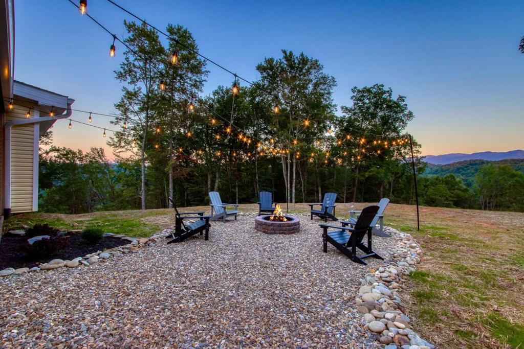 a group of chairs sitting around a fire pit at Powdermill Point Theater Room, Miniature Golf, 560 FREE tickets each paid day! in Sevierville