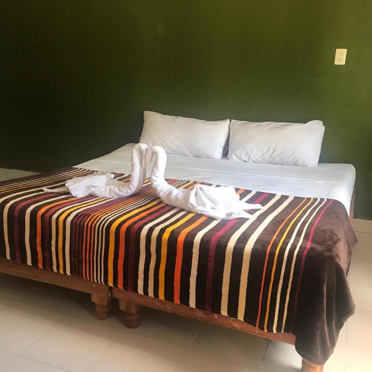 Postel nebo postele na pokoji v ubytování Hotel Maya Balam