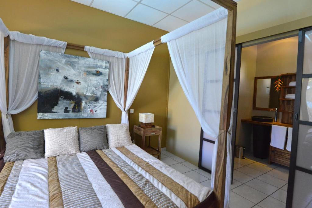 Postel nebo postele na pokoji v ubytování Hotel Ylang Ylang