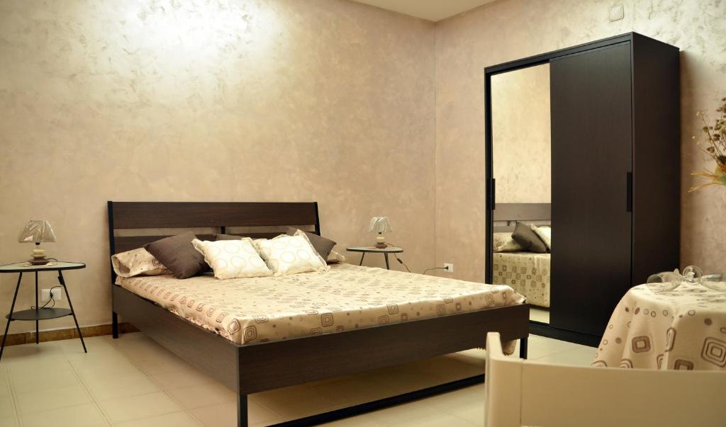 Postel nebo postele na pokoji v ubytování Apta Mihi B&B