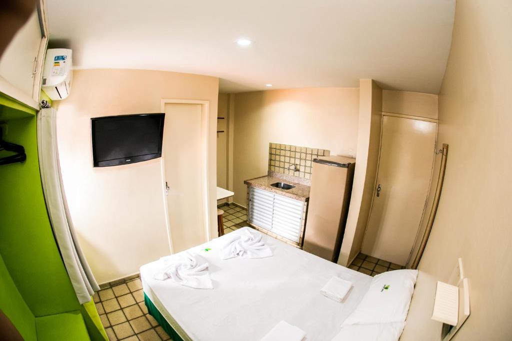 Cama ou camas em um quarto em Cidade Verde Flat Hotel