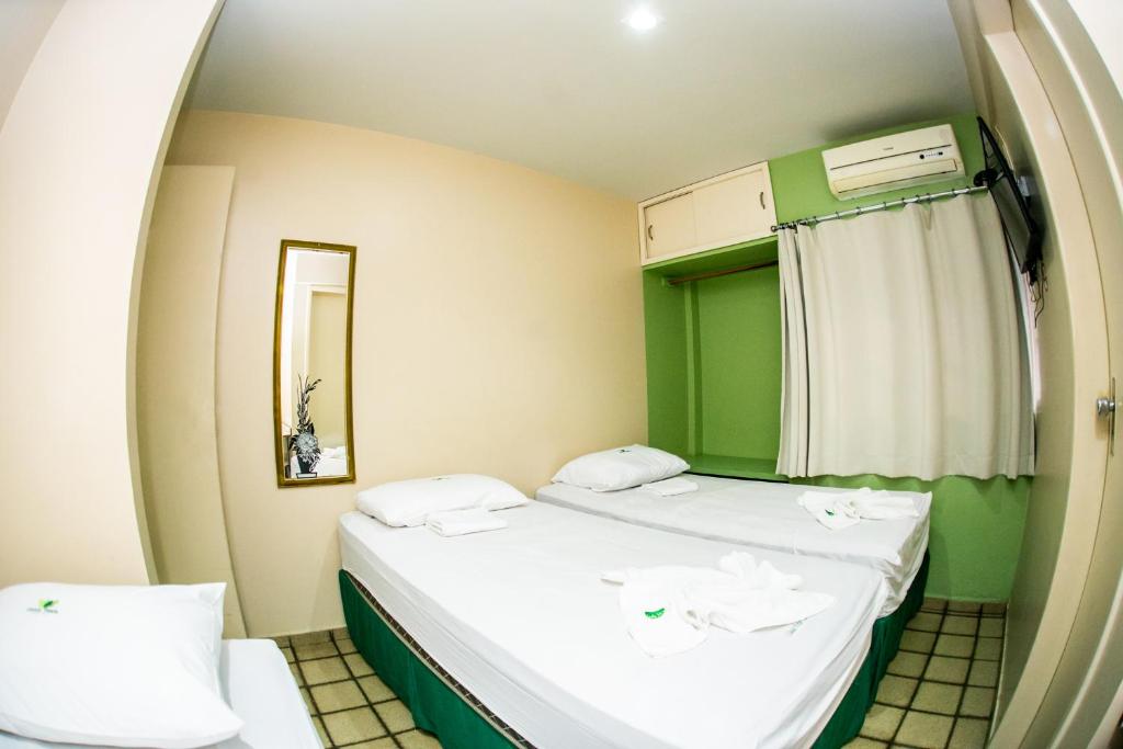 Cama ou camas em um quarto em Cidade Verde Flat Hotel