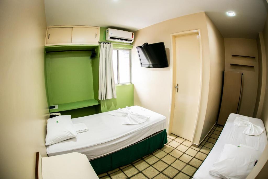 Cama ou camas em um quarto em Cidade Verde Flat Hotel