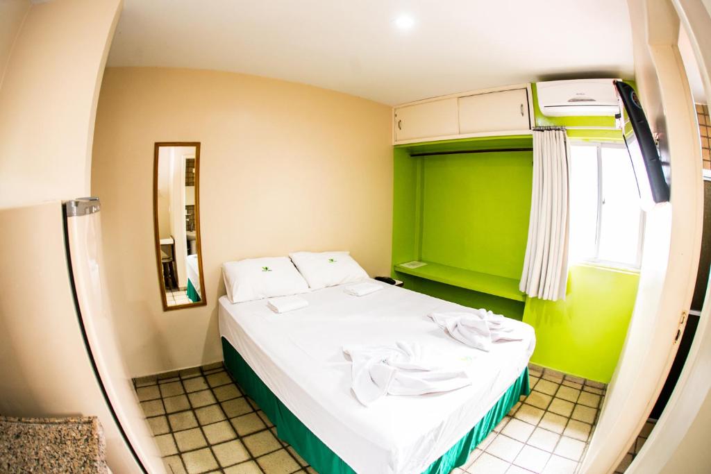 Cama ou camas em um quarto em Cidade Verde Flat Hotel
