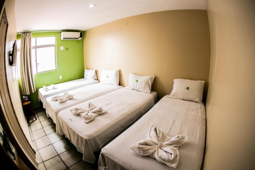 Cama ou camas em um quarto em Cidade Verde Flat Hotel