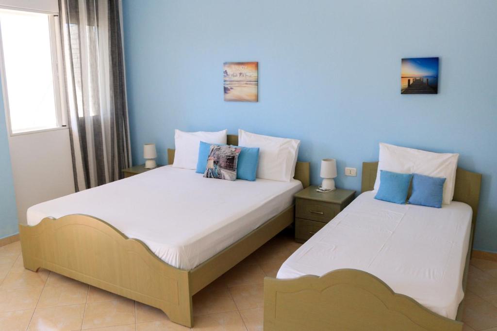 Postel nebo postele na pokoji v ubytování Lumra Rooms