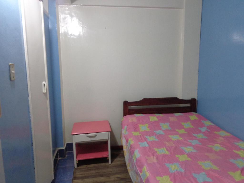 Postel nebo postele na pokoji v ubytování Hostal Yumbo Imperial