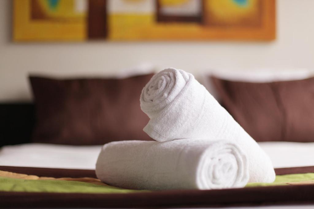 Postel nebo postele na pokoji v ubytování Hotel Sonetto