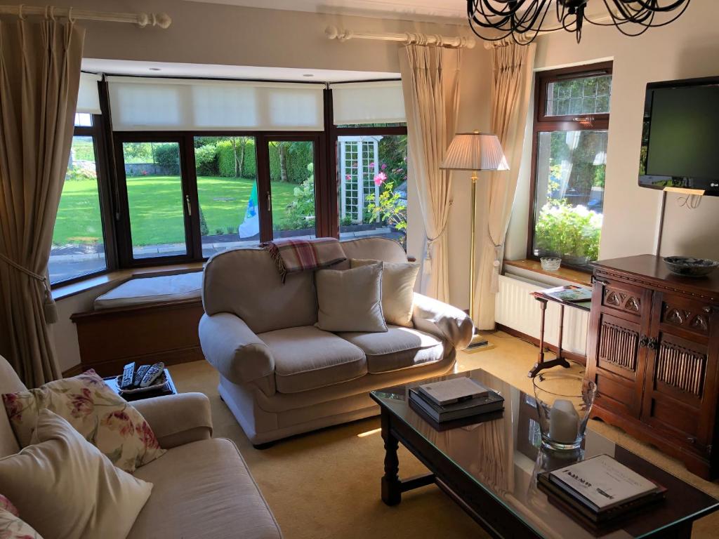 a living room with a couch and a table at Dunaree Bed and Breakfast in Bunratty