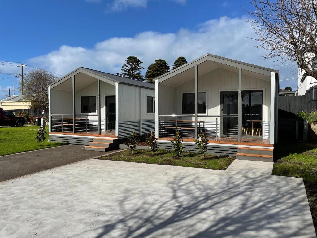 a modular home with a porch and a house at Warrnambool Holiday Village in Warrnambool