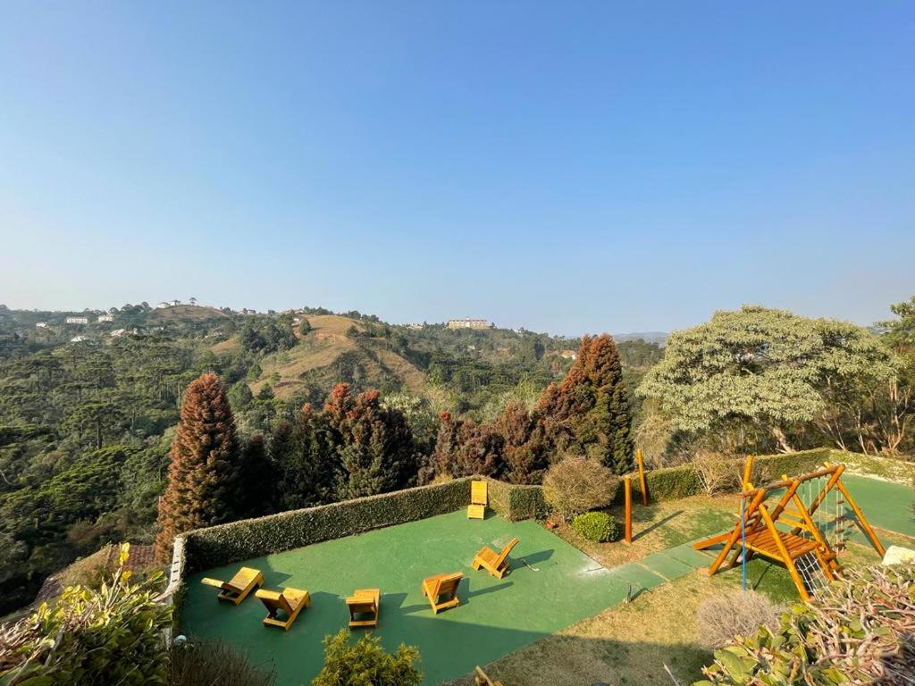 an aerial view of a park with a playground at Pousada Casa de Campos Mountain House in Campos do Jordão