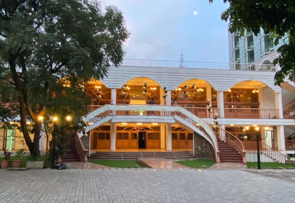 a building with a staircase in front of it at De Leopol Hotel in Addis Ababa