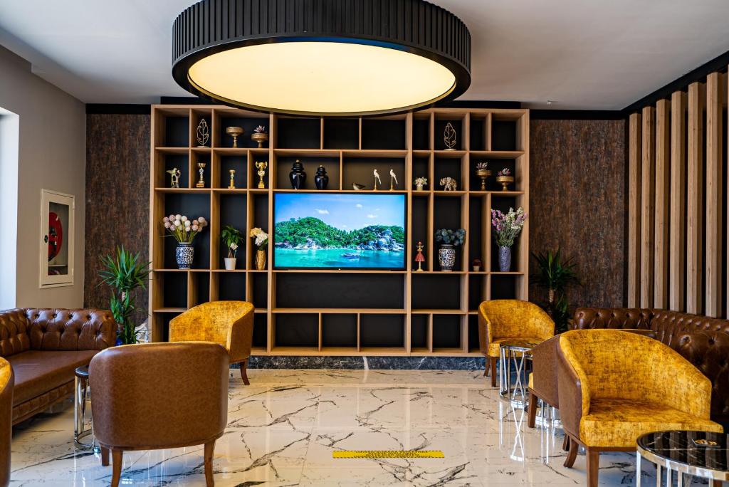 TV a/nebo společenská místnost v ubytování Side Amour Hotel