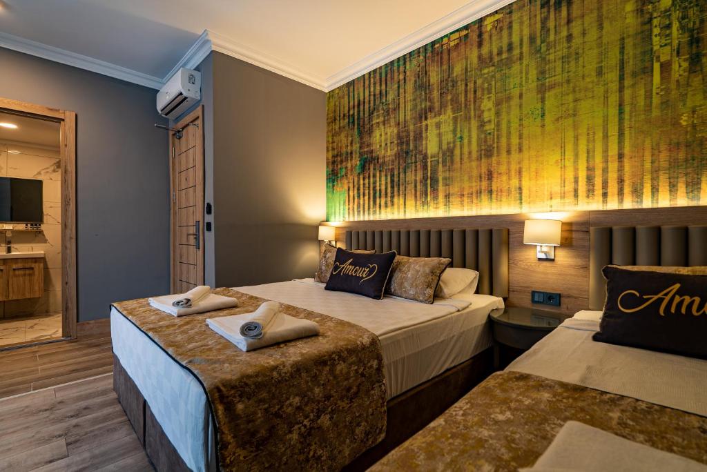 Postel nebo postele na pokoji v ubytování Side Amour Hotel