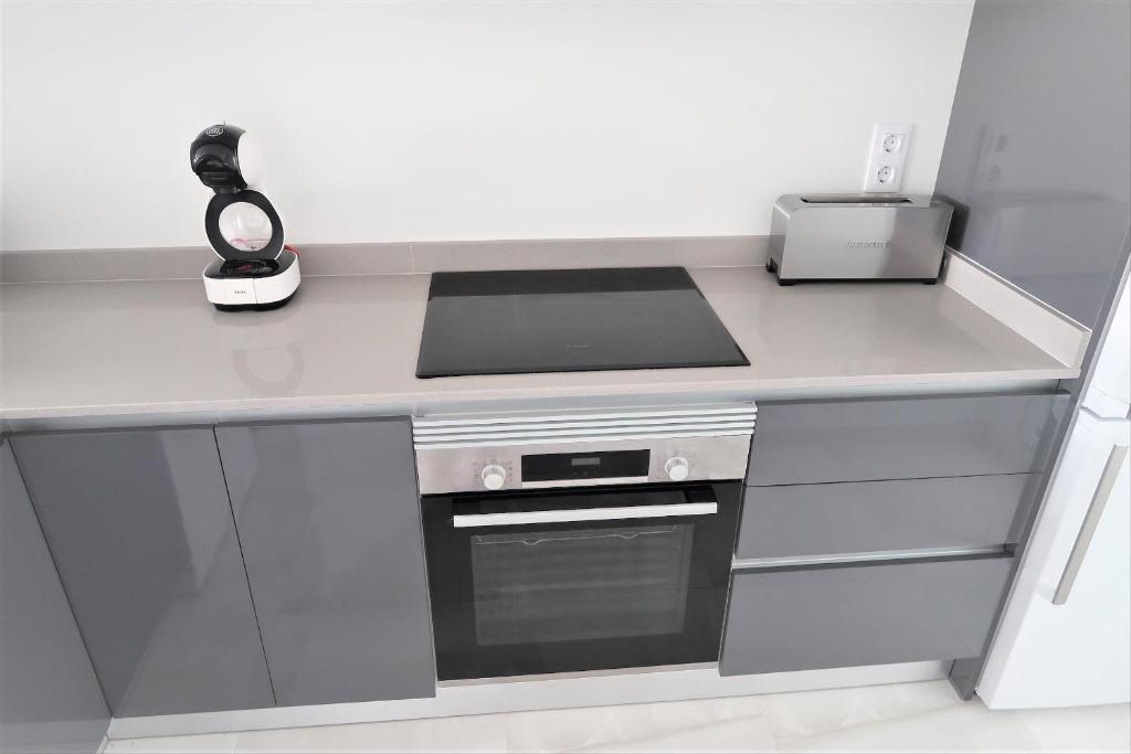 A kitchen or kitchenette at Flamenca Village Penthouse