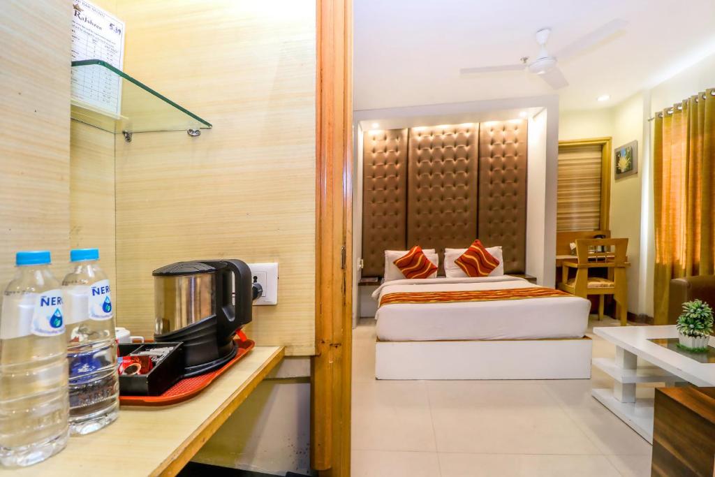 Postel nebo postele na pokoji v ubytování Hotel Rajshree & Spa