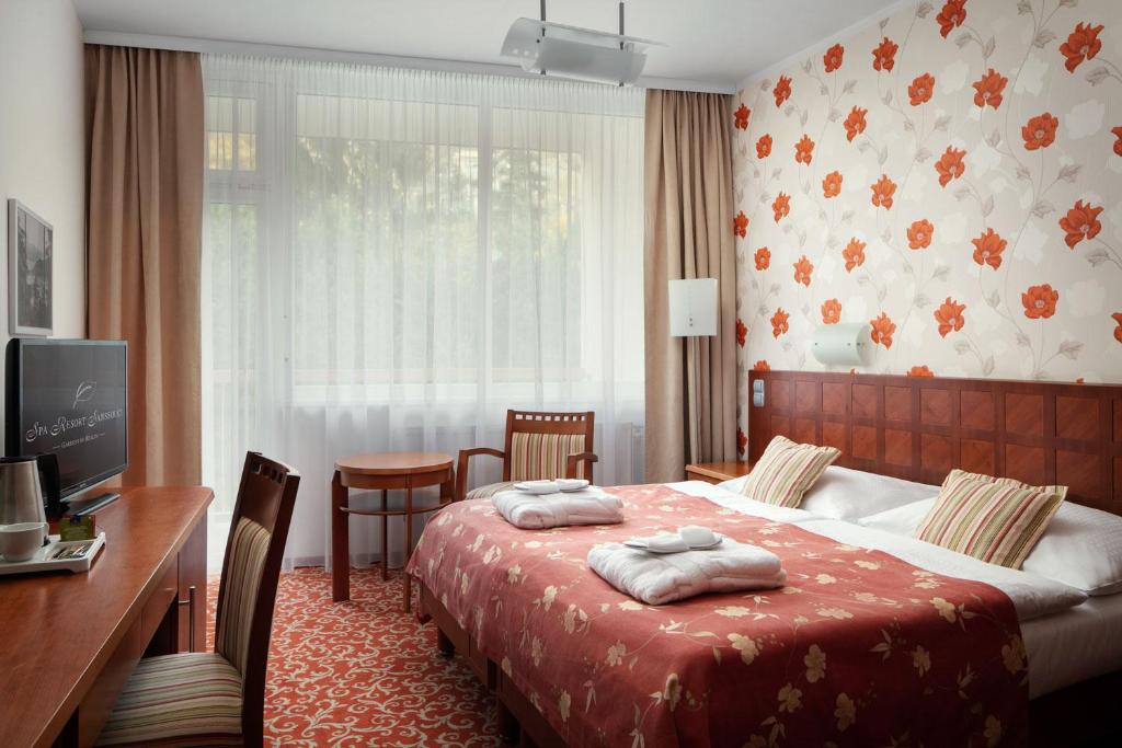 Postel nebo postele na pokoji v ubytování Spa Resort Sanssouci