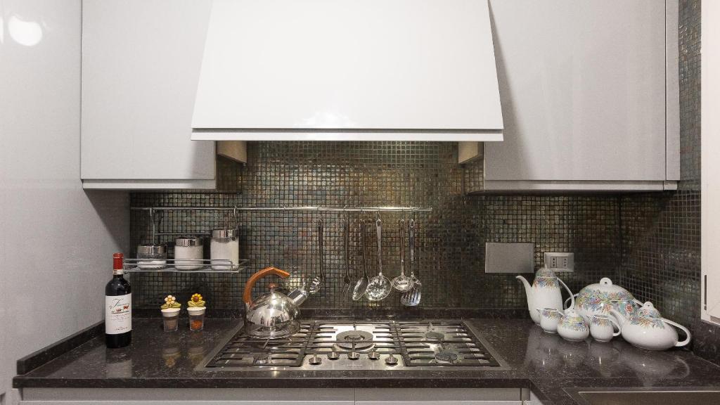 Kuchnia lub aneks kuchenny w obiekcie Gregoriana Luxury Rental in Rome