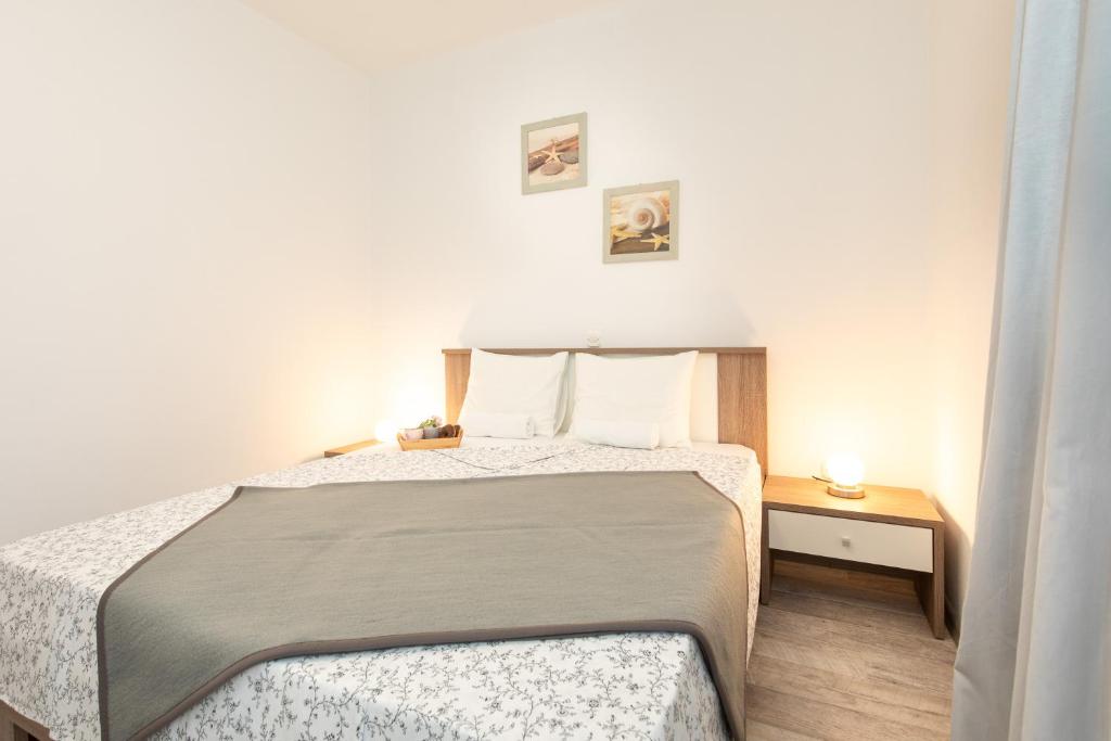 Posteľ alebo postele v izbe v ubytovaní Apartments Doris, Krk