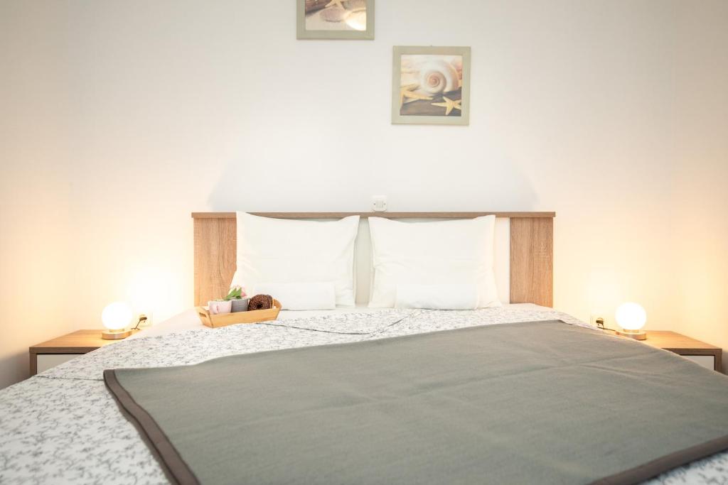 Posteľ alebo postele v izbe v ubytovaní Apartments Doris, Krk