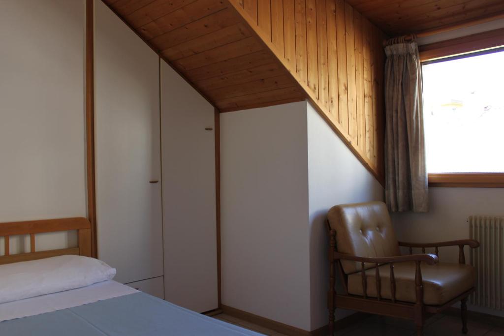 Łóżko lub łóżka w pokoju w obiekcie Albergo Hofer