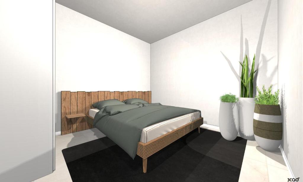 ein Schlafzimmer mit einem Bett und zwei weißen Vasen in der Unterkunft App 204 Palazzo Cavour in Bozen