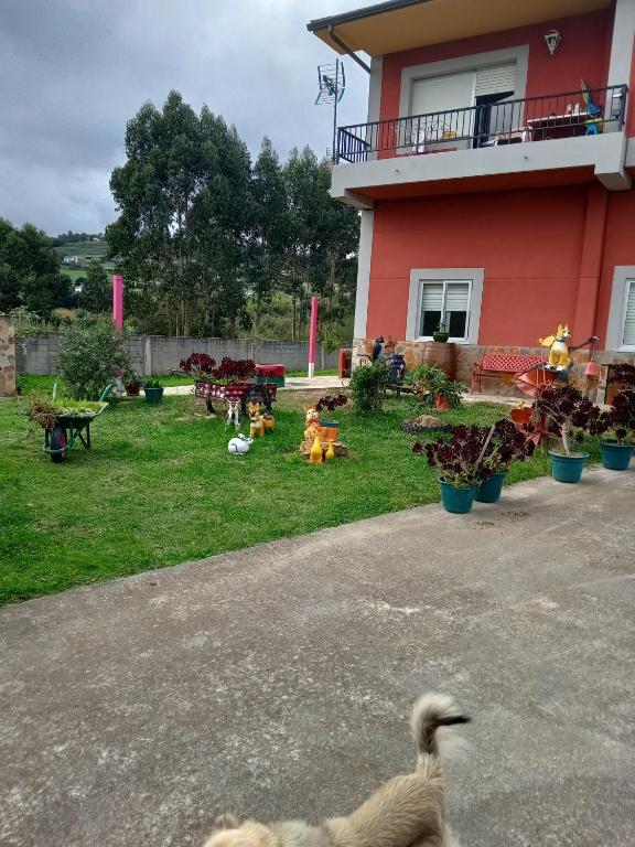 a duck walking in front of a house at Casa Campanita in Ribadeo