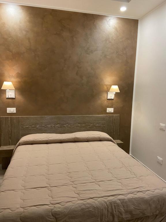 Postel nebo postele na pokoji v ubytování INFORMIS B&B