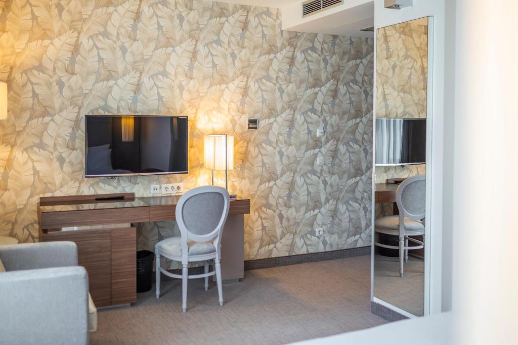 TV o dispositivi per l'intrattenimento presso Belgrade Art Hotel, a member of Radisson Individuals