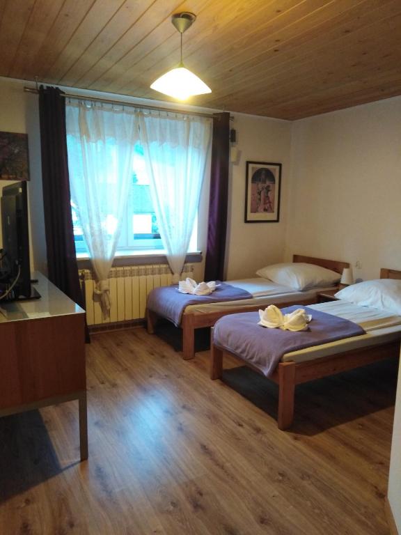 Posteľ alebo postele v izbe v ubytovaní Willa Jacuu