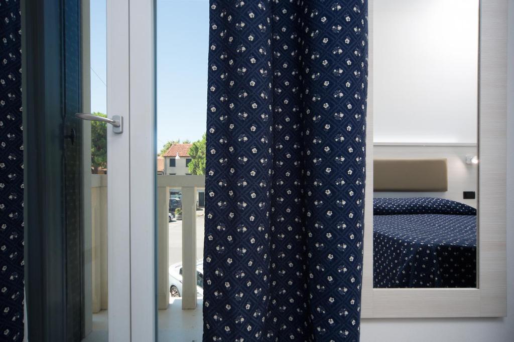 Postel nebo postele na pokoji v ubytování Hotel Giotto
