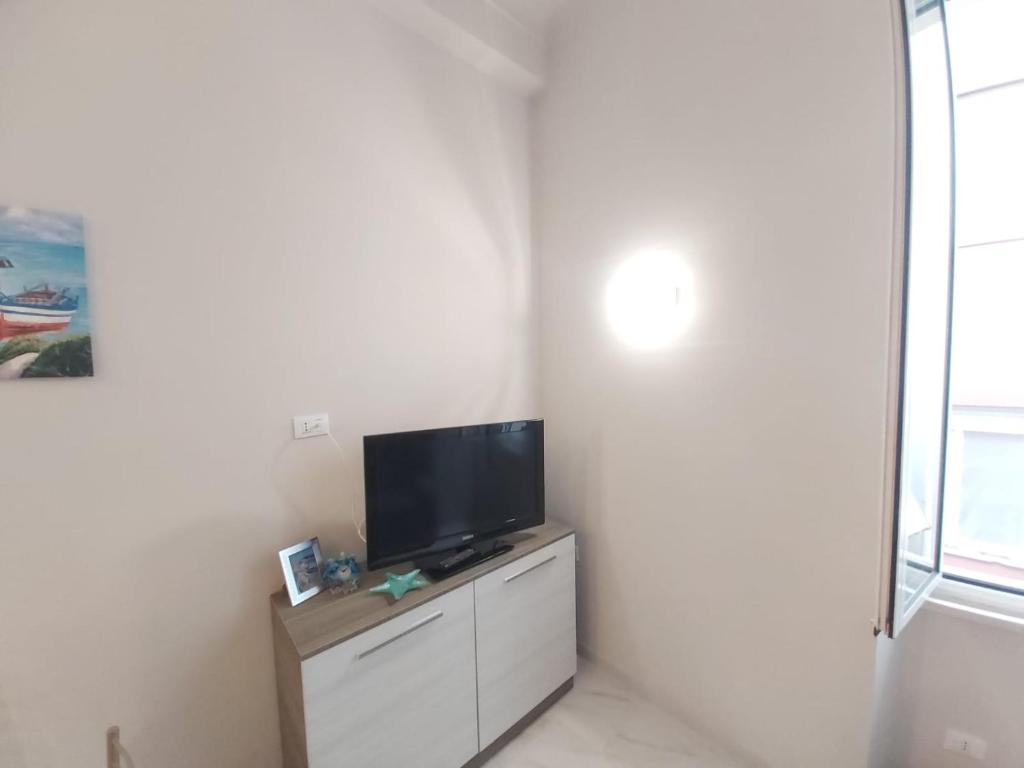 Televízia a/alebo spoločenská miestnosť v ubytovaní Casa Mazzini