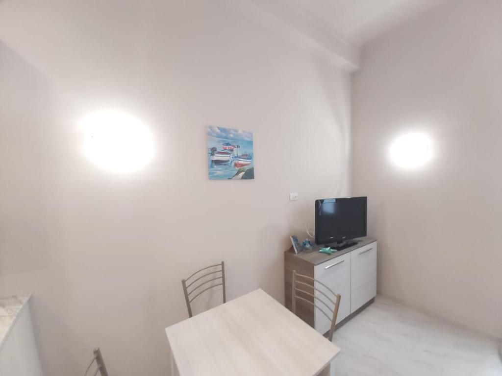 Televízia a/alebo spoločenská miestnosť v ubytovaní Casa Mazzini