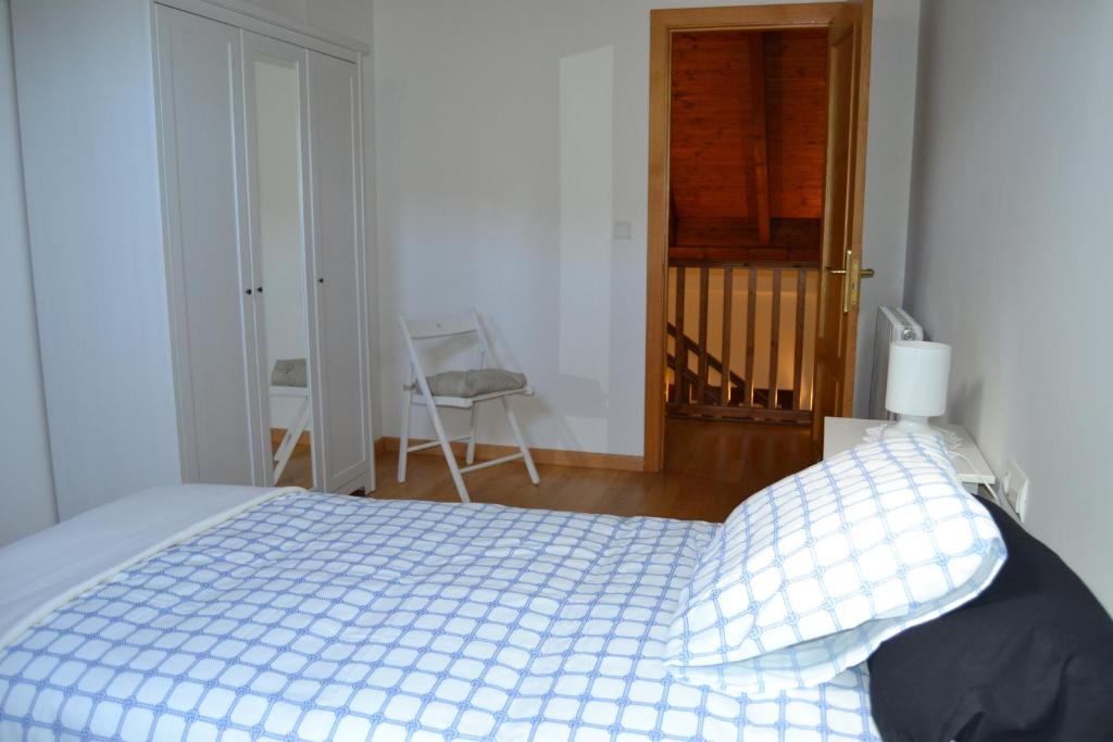 Postel nebo postele na pokoji v ubytování Apartamentos Portal de Ordesa