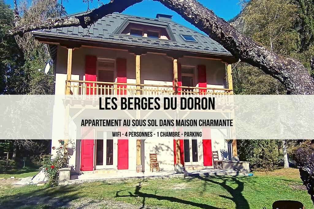 a house with a sign in front of it at Les berges du Doron in Planay