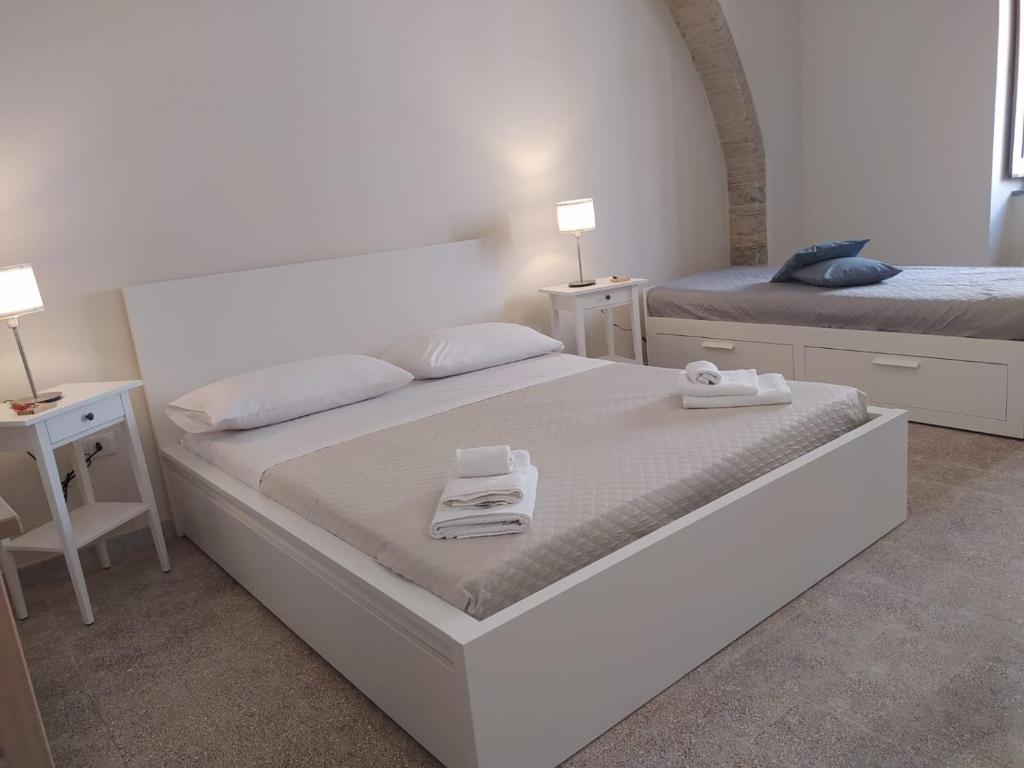 A bed or beds in a room at Affittacamere La Torre