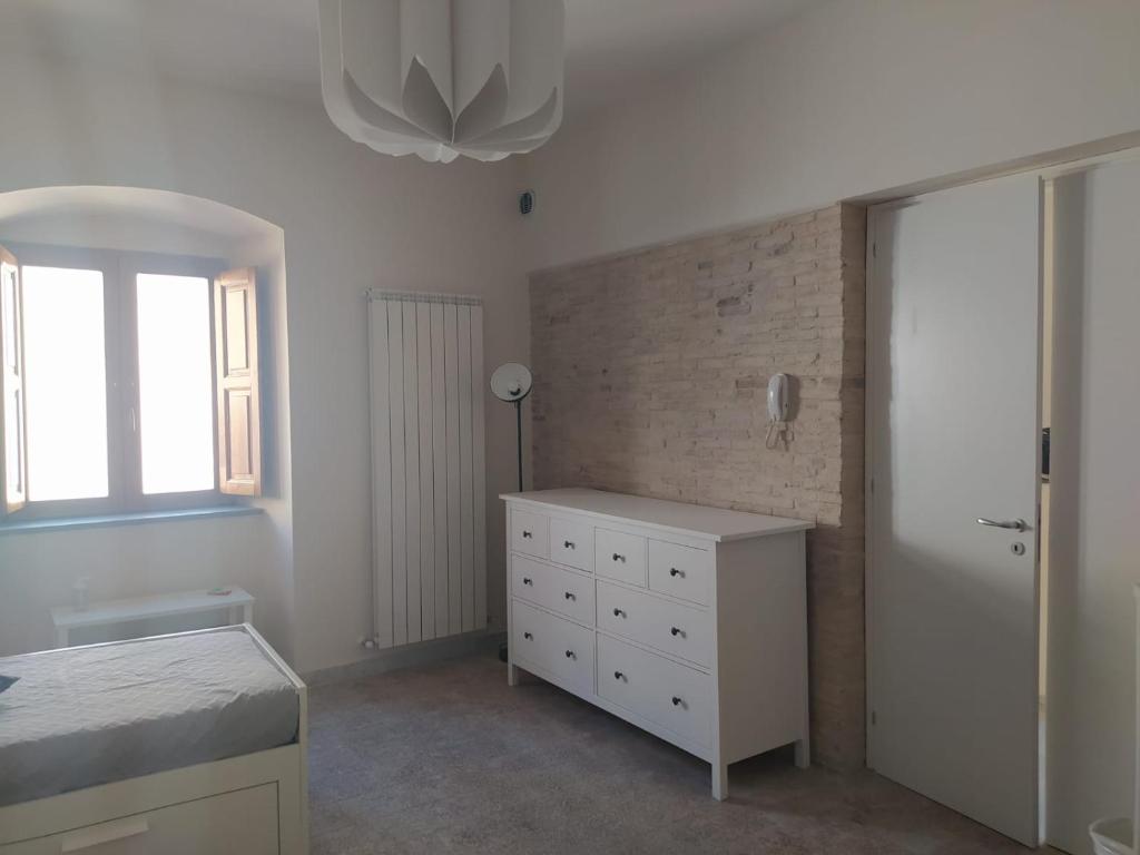 A bed or beds in a room at Affittacamere La Torre