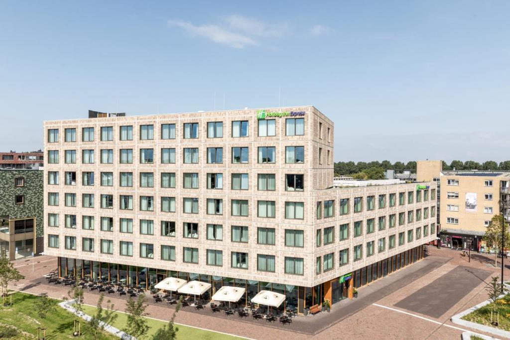 an overhead view of a large white building at Holiday Inn Express - Almere, an IHG Hotel in Almere