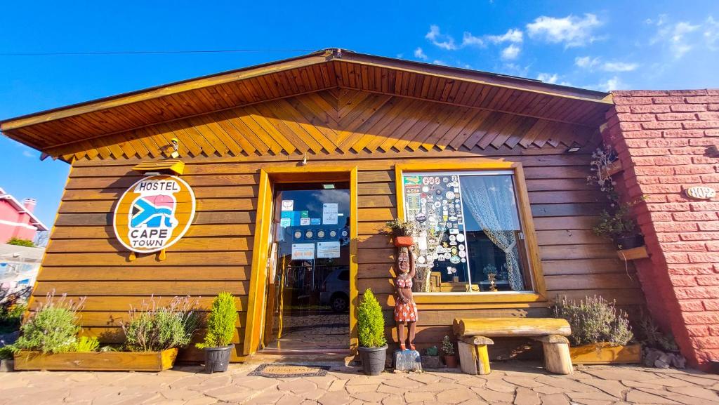 a store with a sign on the front of it at Hostel Cape Town - Cambará do Sul in Cambará