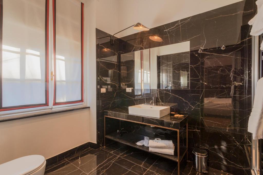 a bathroom with a sink and a mirror at Hotel Villa Alberti Portofino Land in Santa Margherita Ligure