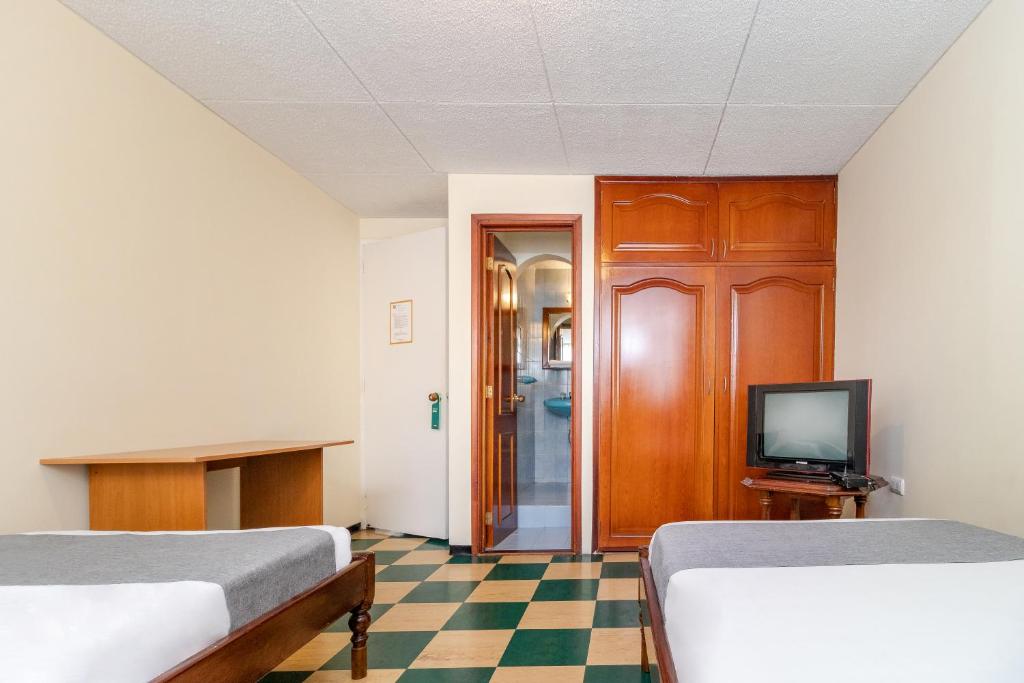 Postel nebo postele na pokoji v ubytování Casa Hostal Norte