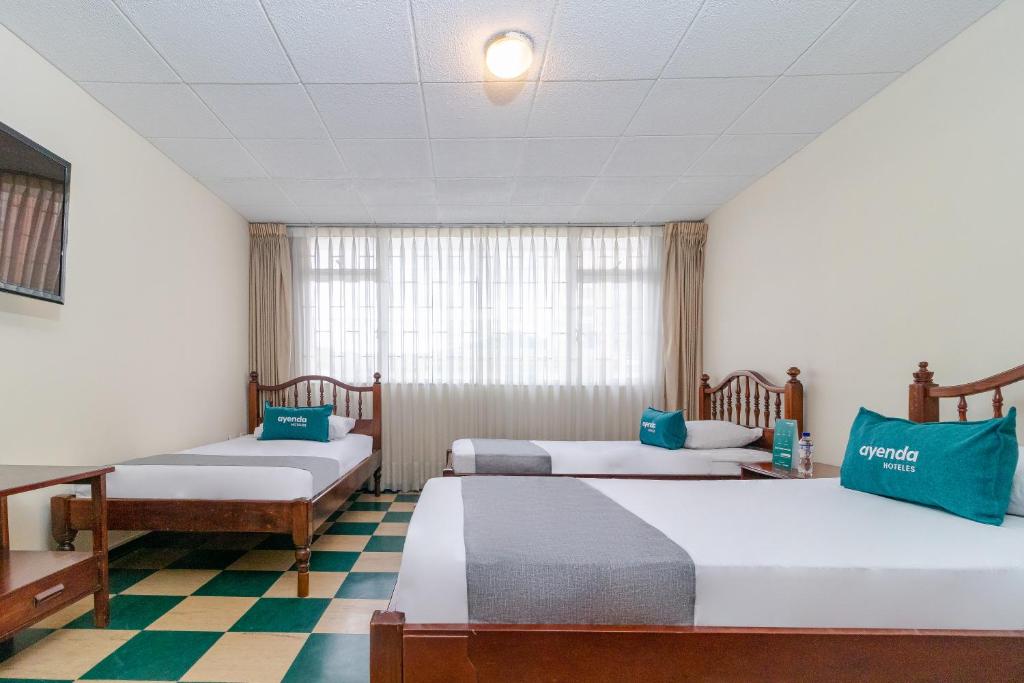 Postel nebo postele na pokoji v ubytování Casa Hostal Norte